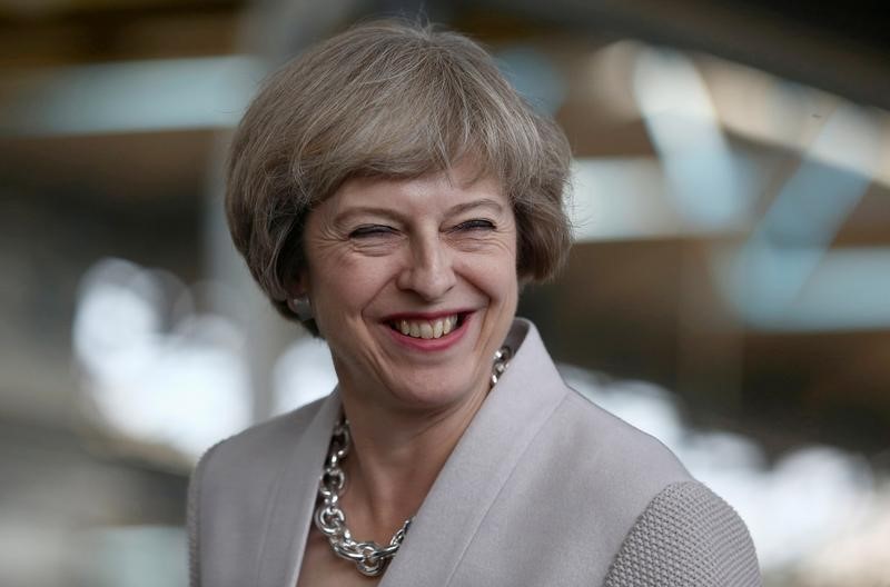 © Reuters. Britain's Prime Minister Theresa May visits a joinery factory in London