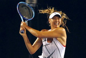 © Reuters. Russia's Maria Sharapova hits a shot during a practice session at Melbourne Park