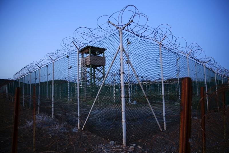 © Reuters. Chain link fence and concertina wire surrounds a deserted guard tower within Joint Task Force Guantanamo's Camp Delta at the U.S. Naval Base in Guantanamo Bay