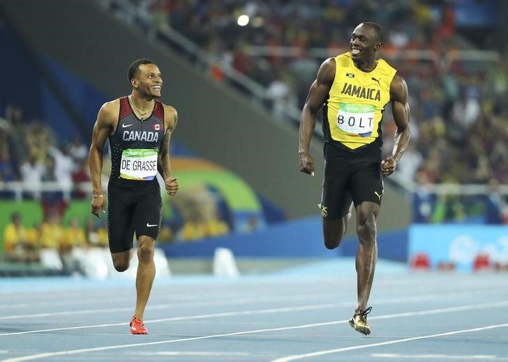 © Reuters. Bolt y De Grasse, destacados en las semifinales de 200 metros, acaba el sueño de Bruno Hortelano