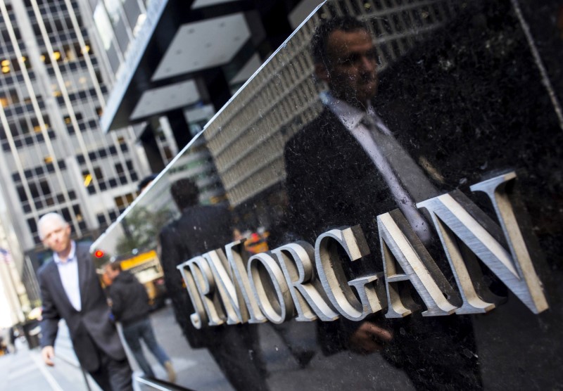 © Reuters. File photo of people walking by the JP Morgan & Chase Co. building in New York