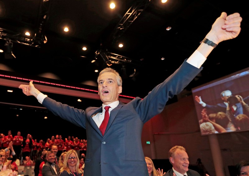 © Reuters. Jonas Gahr Stoere, newly elected chairman of the Norwegian Labour Party (Arbeiderpartiet), stands as he reacts in Oslo