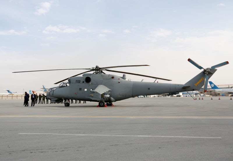 © Reuters. A helicopter donated by India is parked at the airport in Kabul, Afghanistan