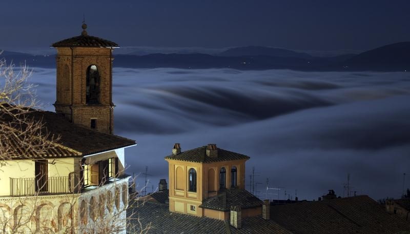 © Reuters. Fog covers the hills in the historical city centre of Perugia