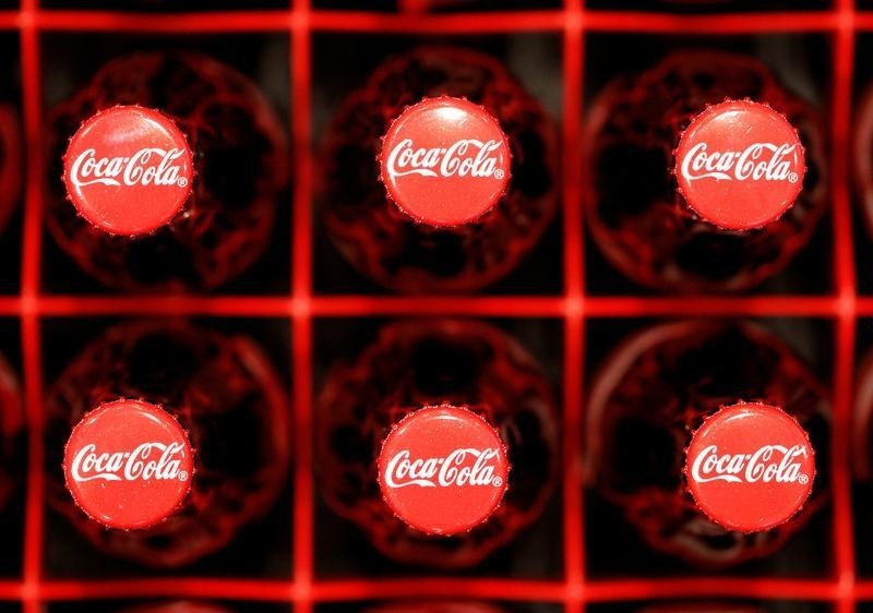 © Reuters. Logos are seen on Coca-Cola bottles