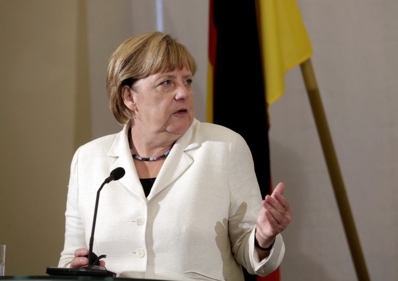 © Reuters. German Chancellor Angela Merkel speaks during a news conference in Tallinn