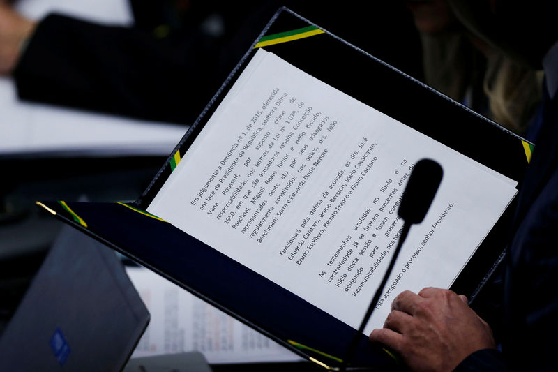 © Reuters. The secretary of the Federal Senate reads the opening of the process during a final session of debate and voting on suspended President Dilma Rousseff's impeachment trial in Brasilia