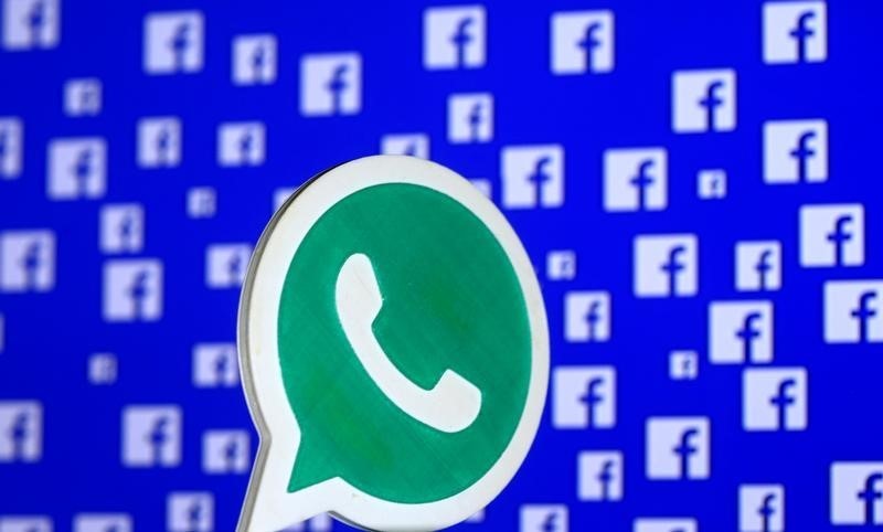 © Reuters. A 3D printed Whatsapp  logo is seen in front of a displayed Facebook logo in this illustration taken