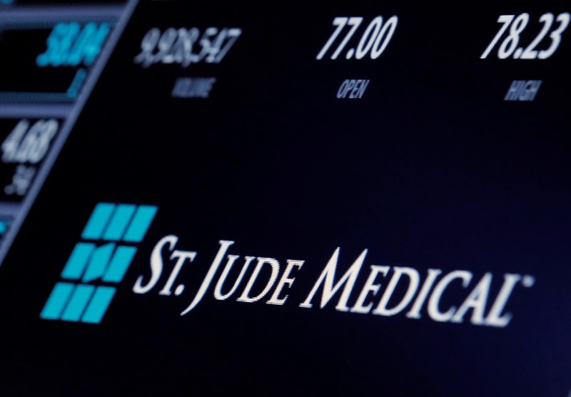 © Reuters. The ticker and trading information for St. Jude Medical is displayed where the stock is traded on the floor of the NYSE