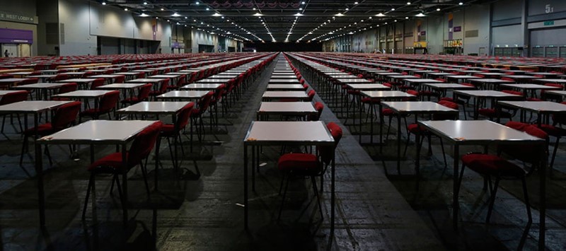 © Reuters. Thousands of tables are seen inside a hall in Hong Kong, one day before SAT examinations to be taken place