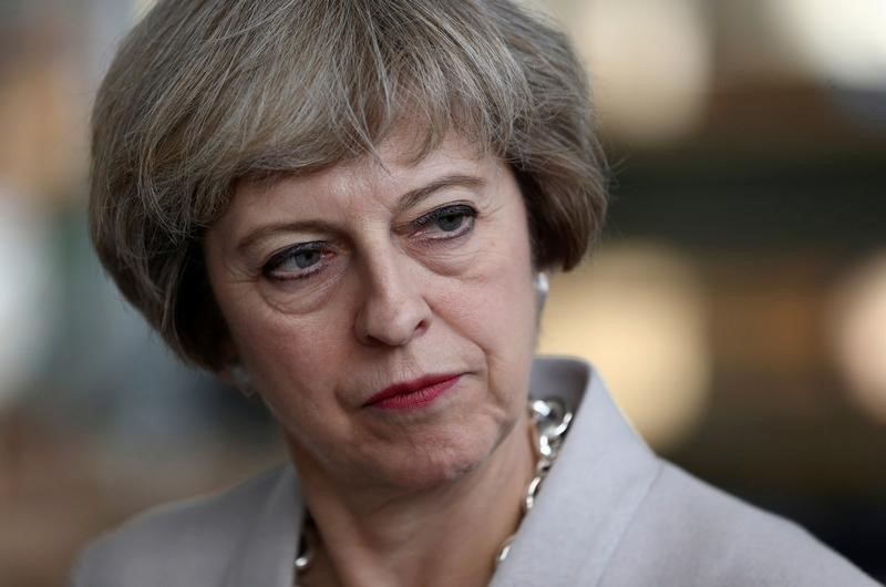 © Reuters. Britain's Prime Minister Theresa May visits a joinery factory in London