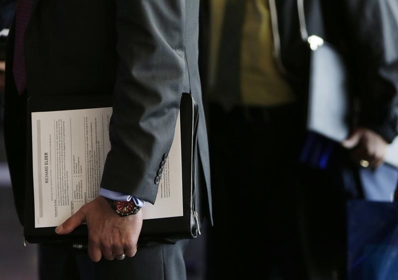 © Reuters. A U.S. military veteran applicant holds his resume at a hiring fair for veteran job seekers and military spouses at the Verizon Center in Washington