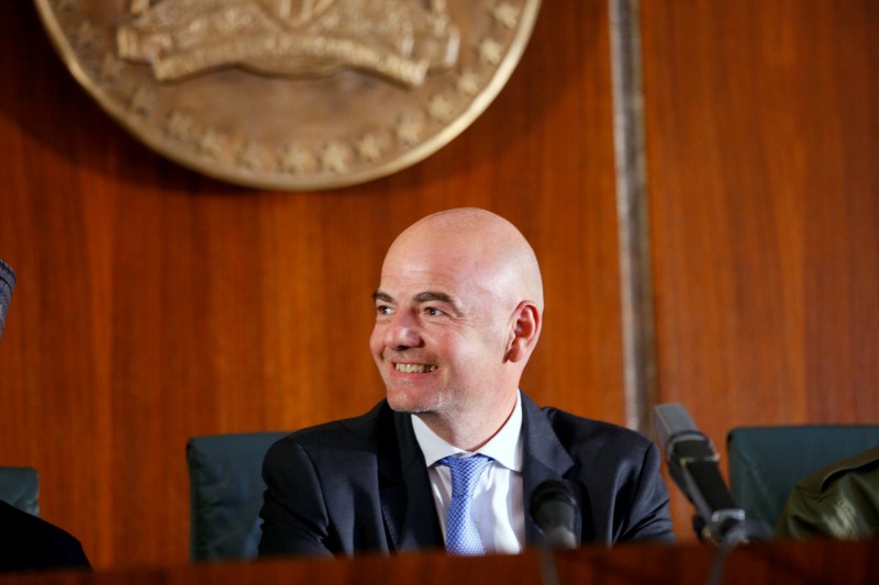 © Reuters. Infantino smiles during his visit in Abuja