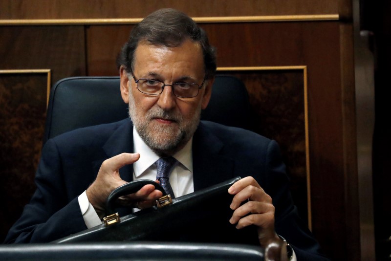 © Reuters. Rajoy attends an investiture debate at parliament in Madrid,