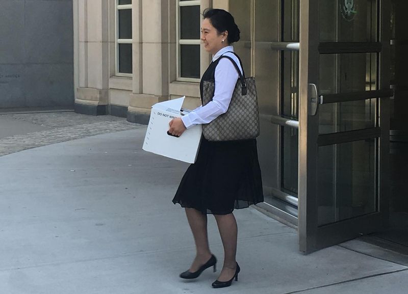 © Reuters. Former Air China employee Ying Lin exits the building after a pretrial hearing in federal court in Brooklyn