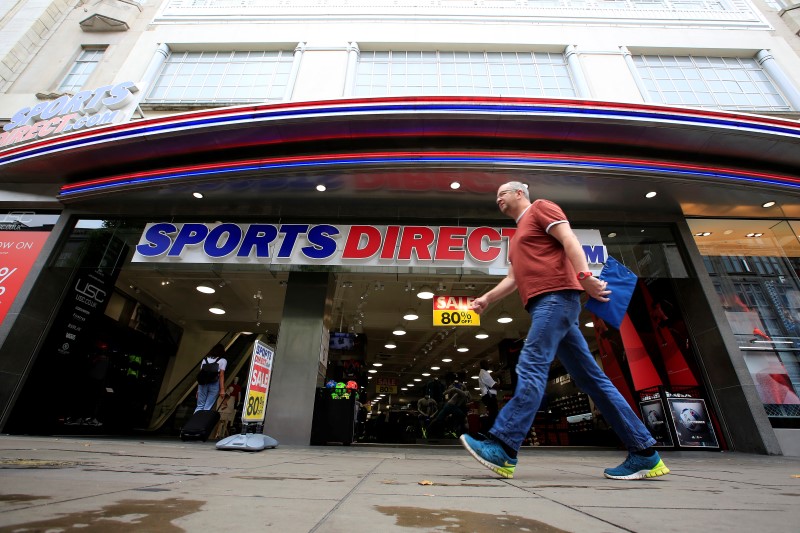 © Reuters. A man walks past a Sports Direct store on Oxford Street in London