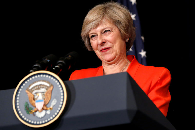 © Reuters. Britain's Prime Minister May smiles while answering a reporter's question after a bilateral meeting with U.S. President Obama alongside the G20 Summit, in Ming Yuan Hall at Westlake Statehouse in Hangzhou, China