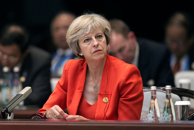 © Reuters. Britain's Prime Minister Theresa May listens to the speech of China's President Xi Jinping during the opening ceremony of the G20 Summit in Hangzhou