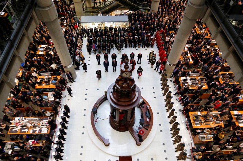 © Reuters. Lloyd's of London staff hold their annual Remembrance Day service at the Lloyd's building in the City of London