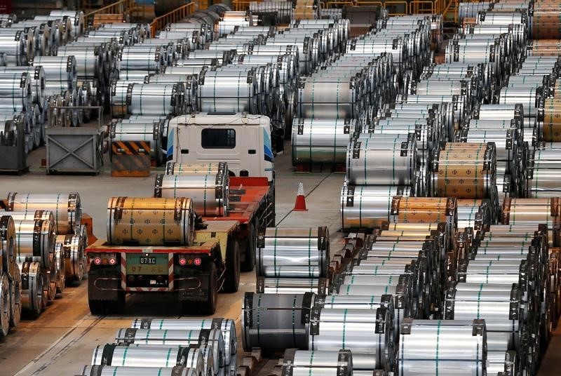 © Reuters. A truck drives past rolls of steel inside the China Steel Corporation factory in Kaohsiung