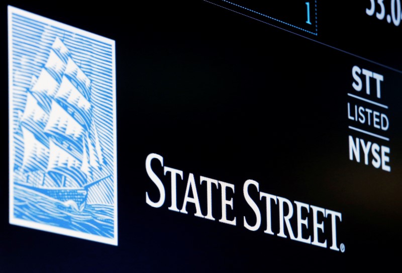 © Reuters. The ticker and logo for State Street Corporation is displayed on a screen at the post where it's traded on the floor of the NYSE