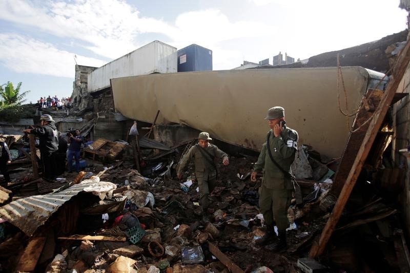 © Reuters. وفاة تسعة أشخاص وفقد اثنين في انهيار طيني بجواتيمالا