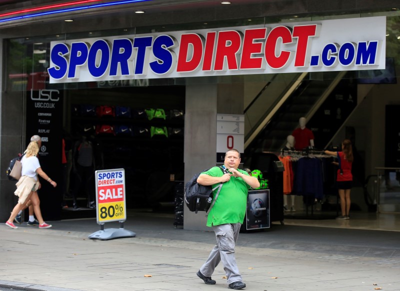 © Reuters. A man walks past a Sports Direct store on Oxford Street in London