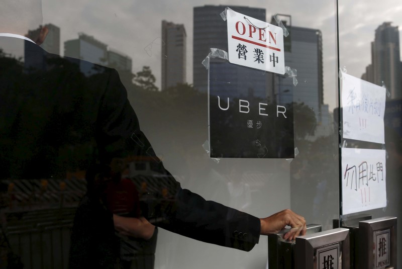 © Reuters. An open sign is seen at the office of taxi-hailing service Uber Inc during a driver recruitment event in Hong Kong