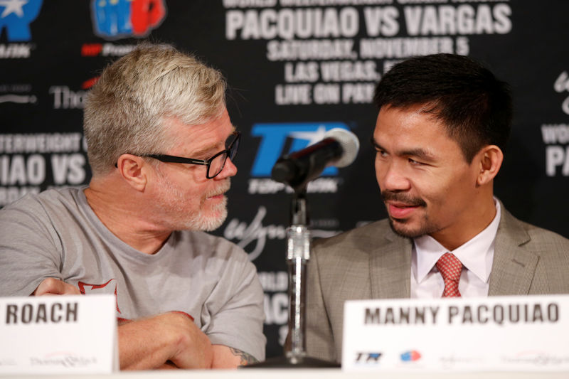 © Reuters. Manny Pacquiao & Freddie Roach during the press conference