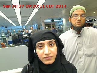 © Reuters. Tashfeen Malik and Syed Farook are pictured passing through Chicago's O'Hare International Airport in this July 27, 2014 handout photo