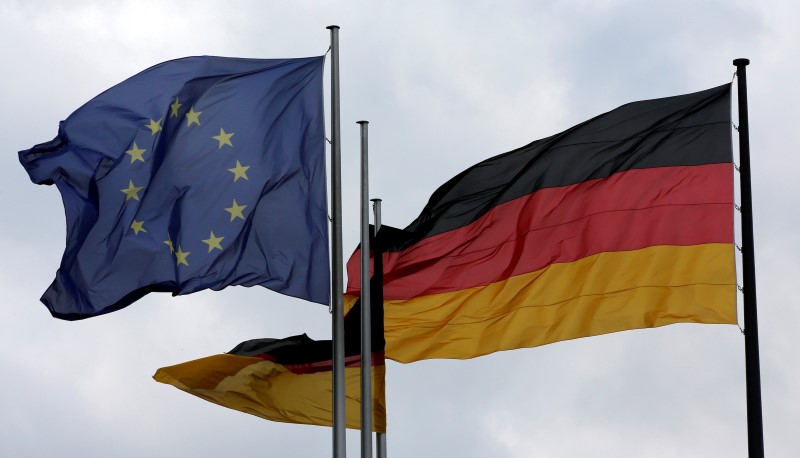 © Reuters. The European Union and German nation flags are pictured before a debate on the consequences of the Brexit vote at the lower house of parliament Bundestag in Berlin