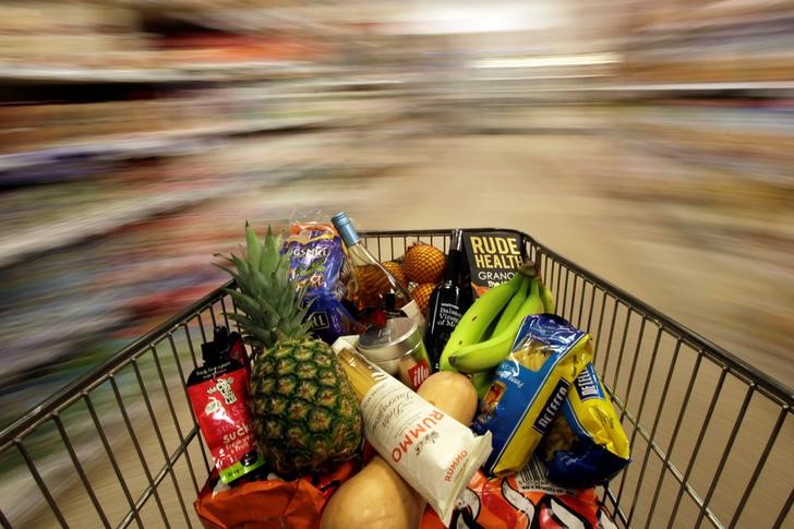 © Reuters. A shopping trolley is pushed around a supermarket in London