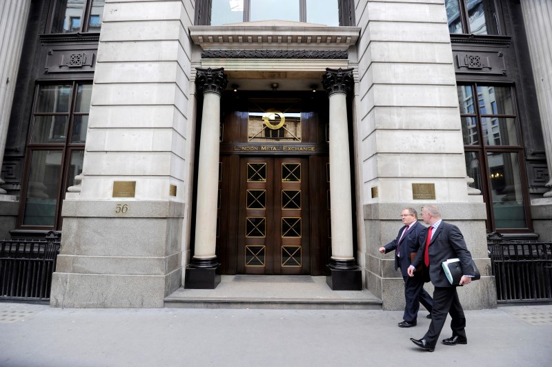 © Reuters. File photo of men walking past the London Metal Exchange (LME) in London