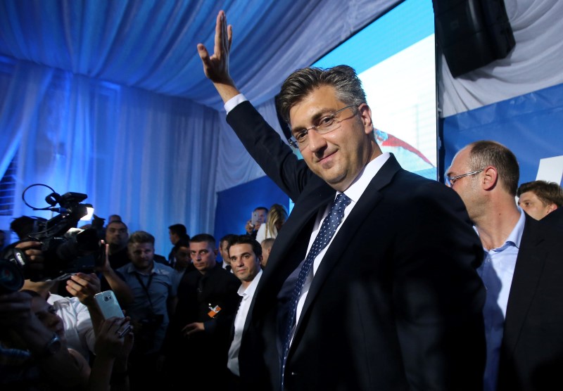 © Reuters. Andrej Plenkovic, president of the Croatian Democratic Union (HDZ), reacts during a speech after exit polls in Zagreb