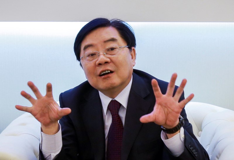 © Reuters. Xu Jianyi, former chairman of FAW Group Corp, gestures as he attends an event in Shanghai