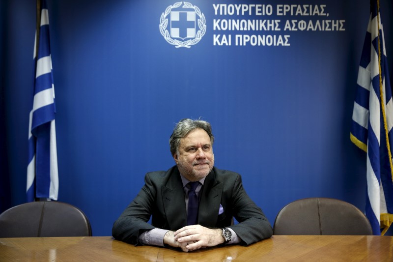 © Reuters. Greek Labour Minister Katrougalos poses for a picture before an interview with Reuters at his office at the ministry in Athens