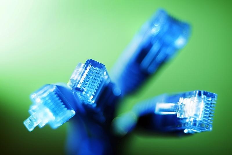 © Reuters. Internet LAN cables are pictured in this photo illustration taken in Sydney