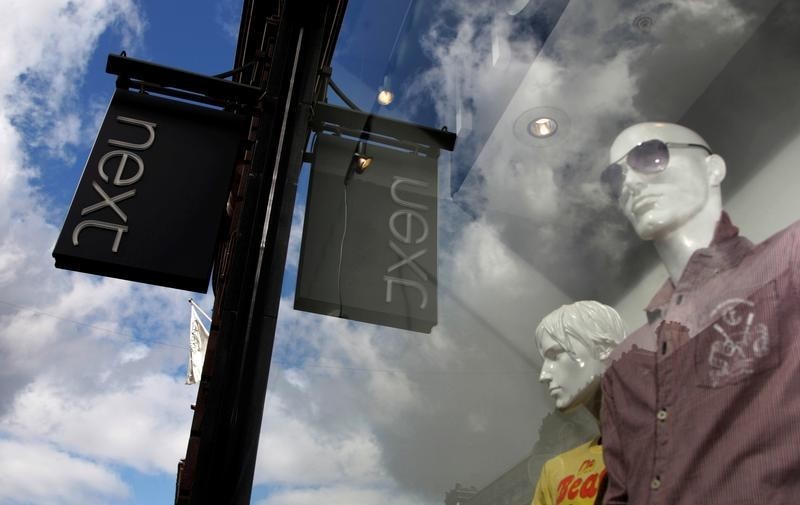 © Reuters. Mannequins are pictured in the window of a Next clothing store in London