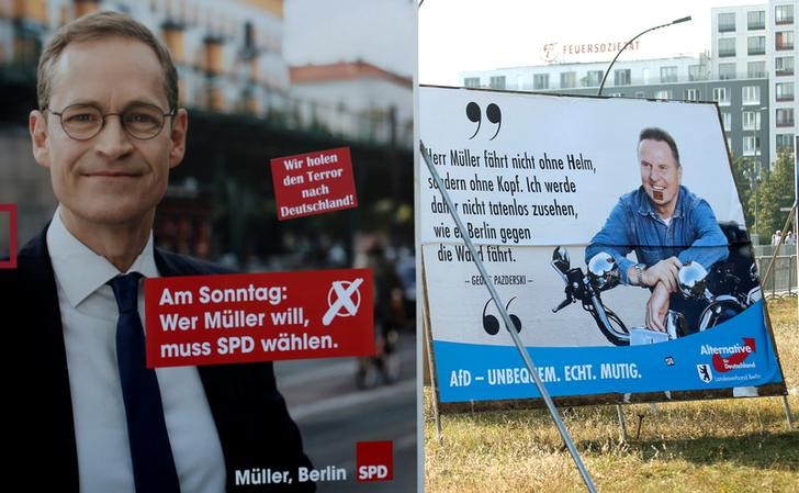 © Reuters. Election posters of top candidate of Social Democratic Party and Mayor of Berlin Mueller and top candidate of the anti-immigration party Alternative for Germany Pazderski for local city elections are pictured in Berlin