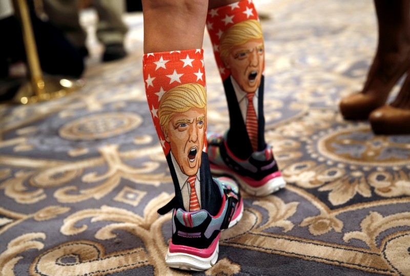 © Reuters. 11-Year-old Millie March wears socks with the image of Republican presidential nominee Donald Trump on them at a Trump campaign event at the Trump International Hotel in Washington