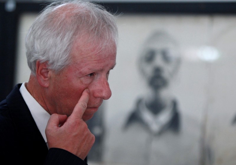 © Reuters. Canada's Foreign Minister Dion gestures during his visit to the Tuol Sleng Genocide Museum in Phnom Penh