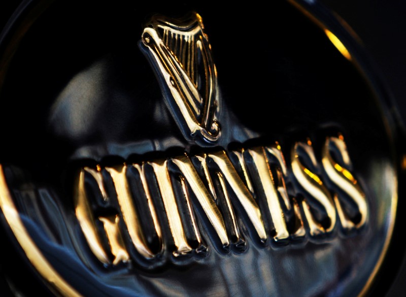 © Reuters. Guinness branding is seen outside a pub in London
