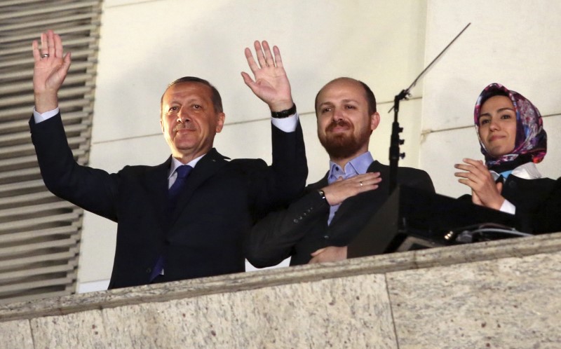 © Reuters. Turkish Prime Minister Tayyip Erdogan, accompanied by his son Bilal and daughter Sumeyye, greets his supporters in Ankara