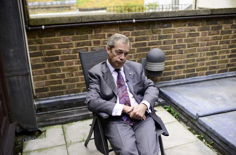 © Reuters. Former UKIP leader Nigel Farage poses for a picture during an interview with Reuters at his Westminster office in London