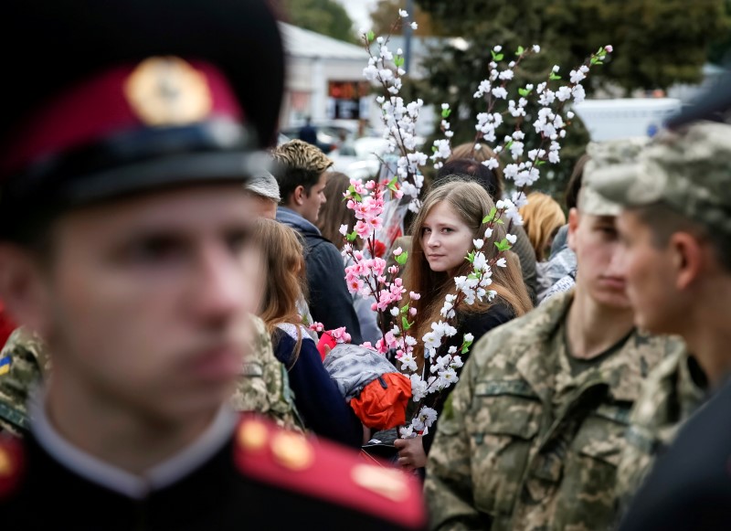 © Reuters. People and military cadets attend a Peace March to mark the International Day of Peace