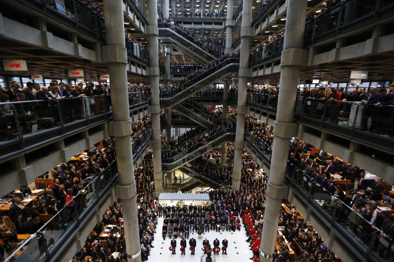 © Reuters. Lloyd's of London staff hold their annual Remembrance Day service at the Lloyd's building in the City of London