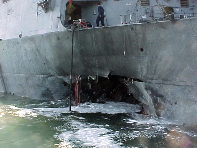 © Reuters. File photo of damaged guided missile destroyer USS Cole after bomb attack in the port of Aden