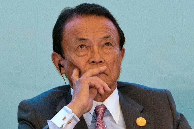 © Reuters. Taro Aso, Japan's Deputy Prime Minister, attends a panel for the High-level Tax Symposium held in Chengdu