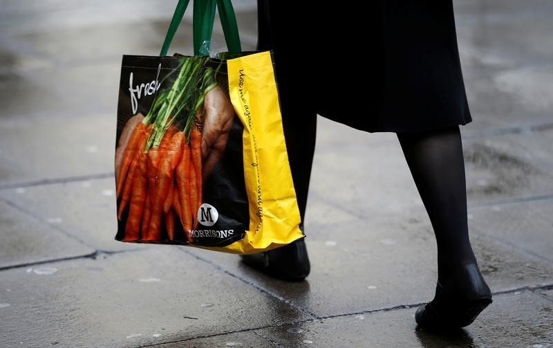 © Reuters. A shopper leaves a Morrisons supermarket in south London