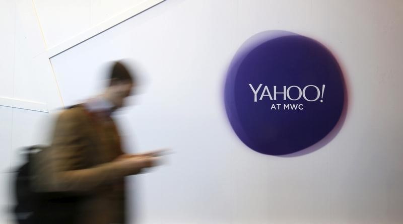 © Reuters. File photo of a man walking past a Yahoo logo during the Mobile World Congress in Barcelona